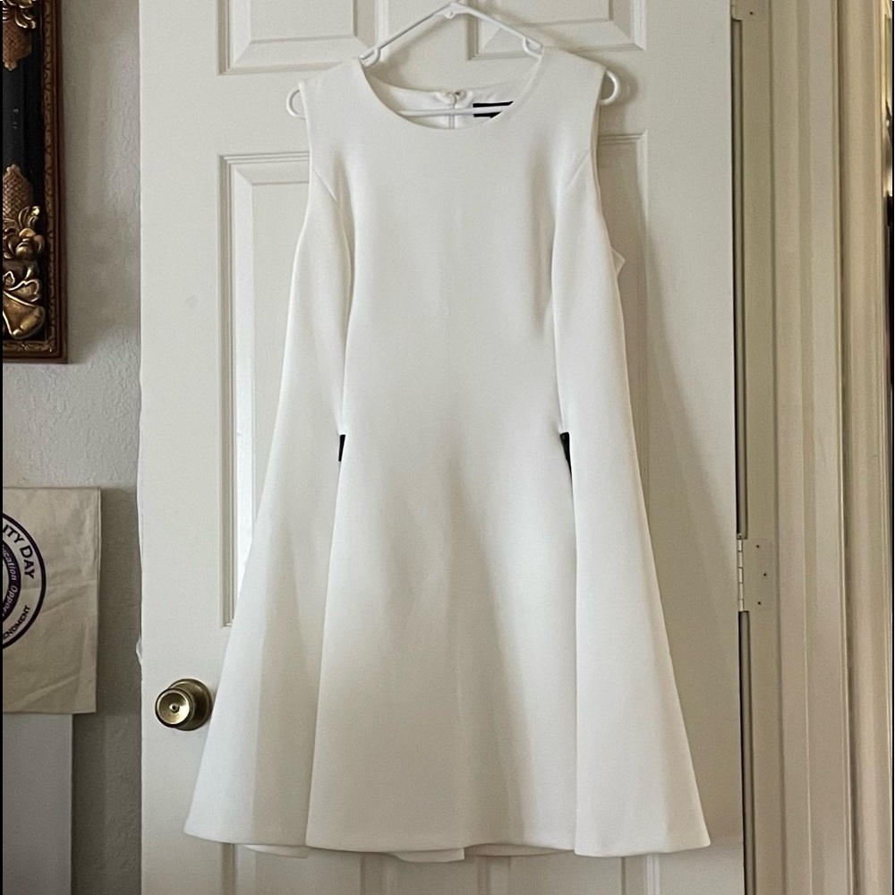 DKNY white fitted dress. Fully lined, two front pockets with zipper closure.